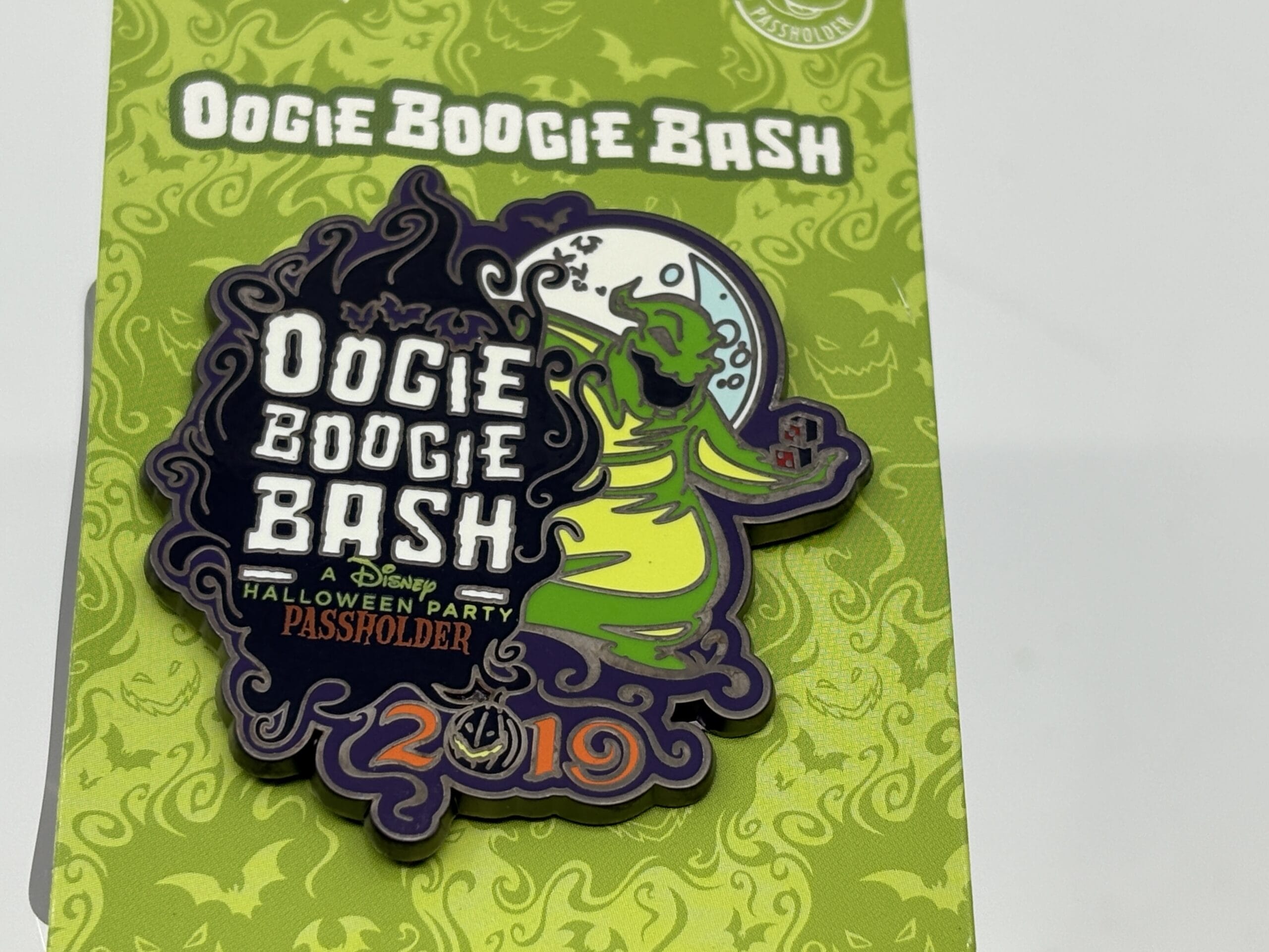 A Disney Oogie Boogie Bash 2019 Passholder pin, offered in the WDWNT Summer Auction, with a green and black background.