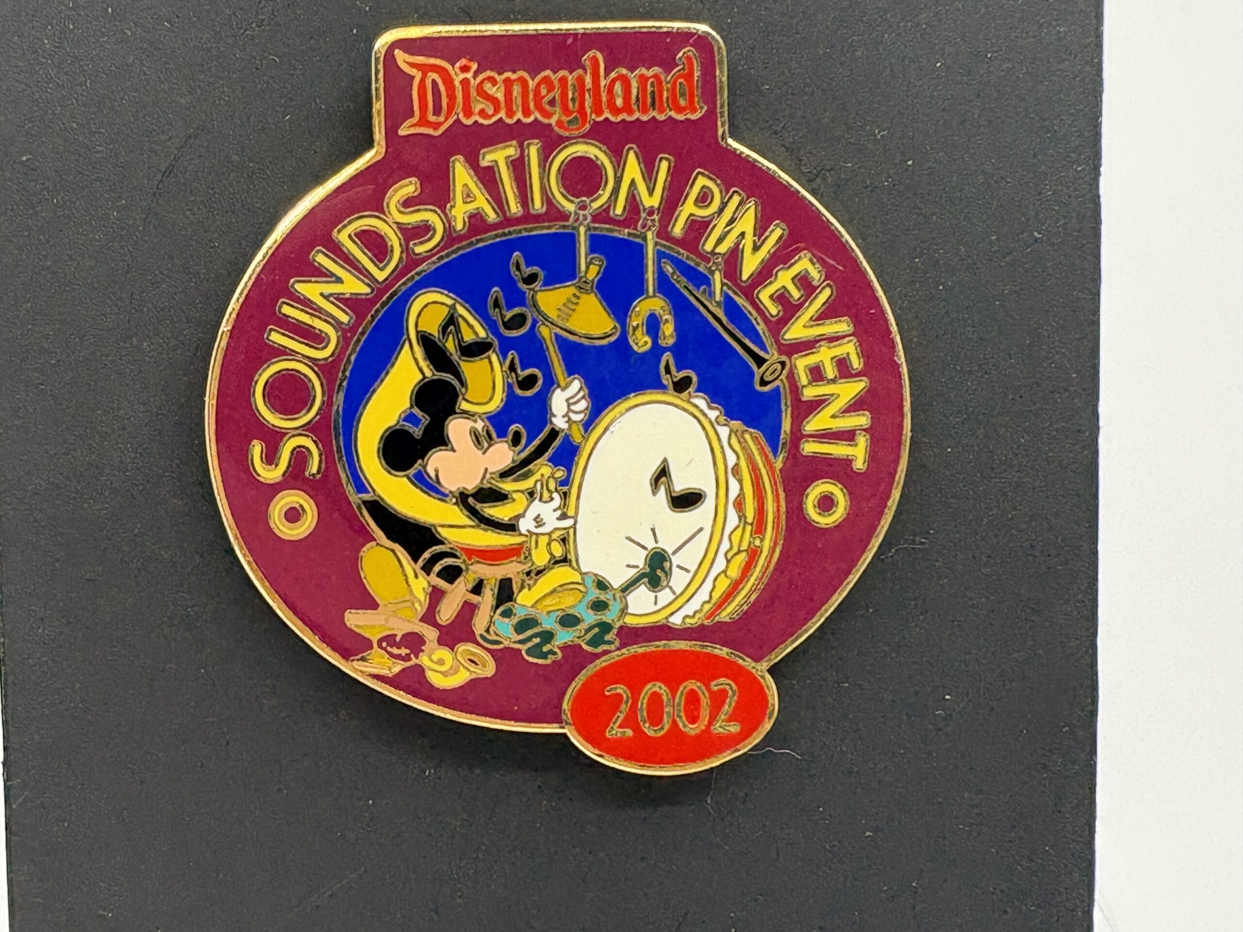 A Disneyland 2002 pin with Mickey Mouse on drums from the "Soundsation Pin Event" at the wdwnt summer auction.