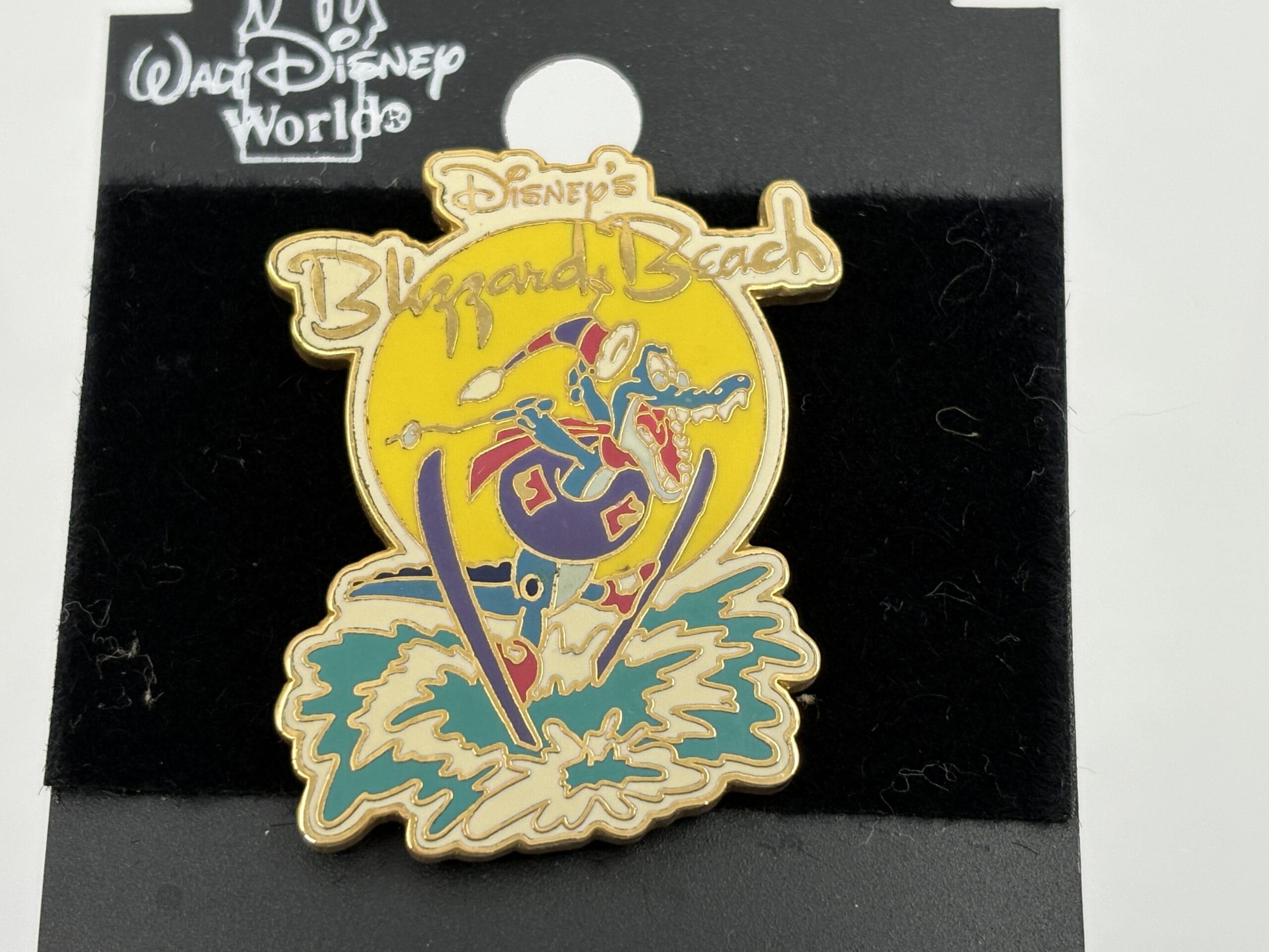 Disney’s Blizzard Beach pin features a cartoon alligator snowboarding, offered in the WDWNT Summer Auction.